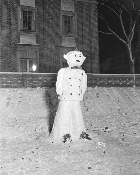 Winter scene with snowman at the Phi Kappa Psi fraternity house, at 811 State Street.