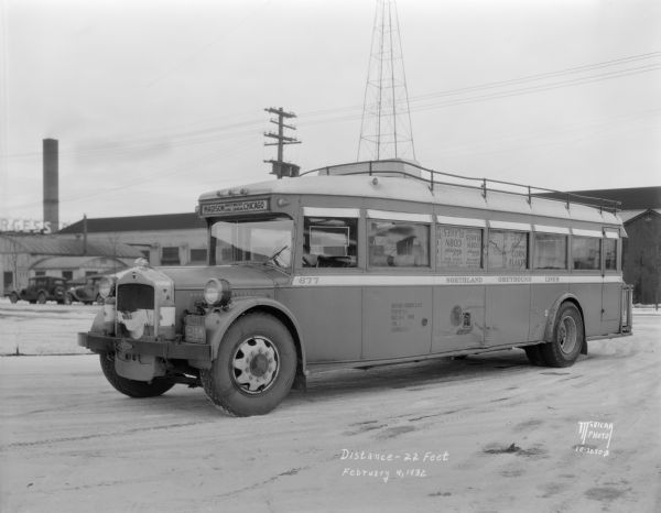 Three-quarter view from front left of a White Motor Company Northland Greyhound Lines damaged bus.
