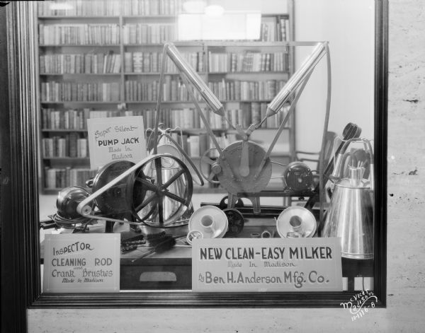 Display window of New Clean Easy Milker manufactured by Ben H. Anderson at the Madison Association of Commerce at 122 W. Washington Avenue.