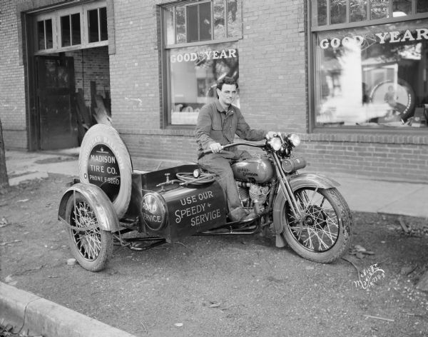 Harley-Davidson motorcycle, used as a service vehicle for the Madison Tire Company, distributor of Goodyear tires, at 205 North Bassett Street.