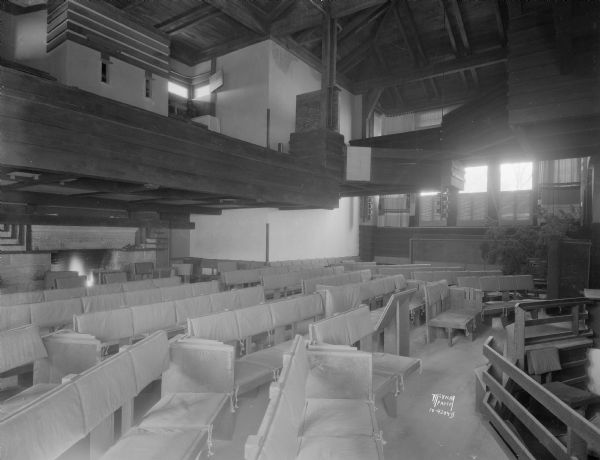 The new Taliesin Hillside Theater, looking toward the rear of the theater, showing the balcony and projection box for moving pictures. Underneath is a large fireplace where tea will be served between acts. Taliesin is located in the vicinity of Spring Green, Wisconsin.