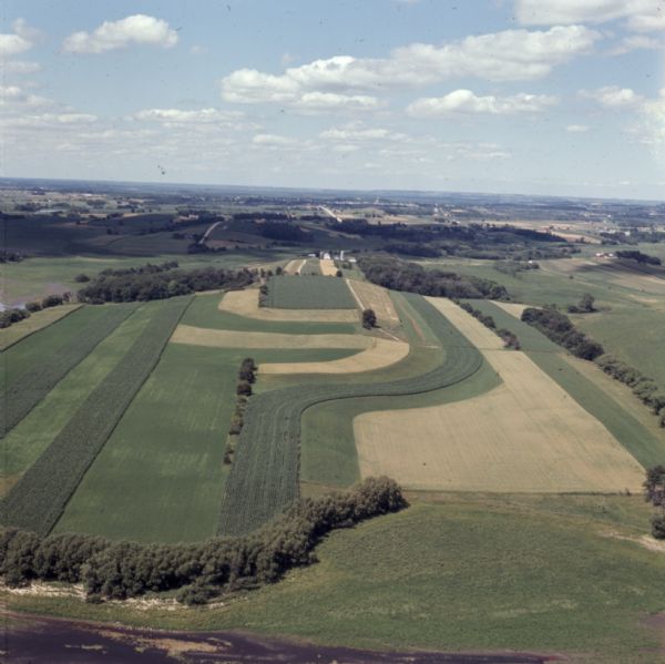 Aerial view of strip cropped farmland.