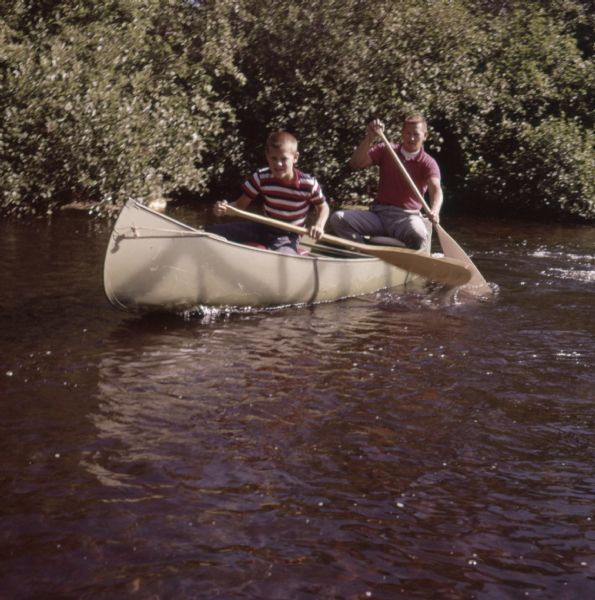 A father and son canoeing down the Namekagon River.