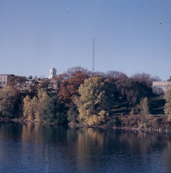 Elevated view over the Fox River towards Lawrence University on the far shoreline in the autumn.