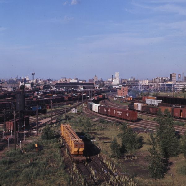 Elevated view of the Milwaukee railroad yard. The skyline of Milwaukee is in the background.