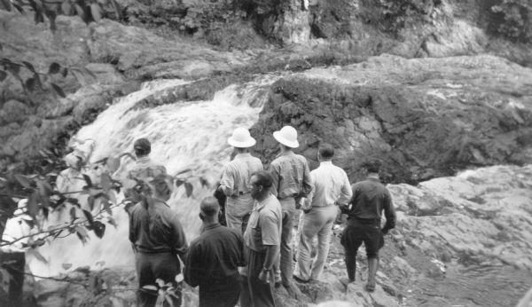 Elevated view of a group of Georgia Junior Rangers and their guides viewing the Copper Falls of the Bad River.