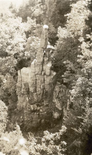 An elevated view of the rock formation in Devil's Lake State Park known as Cleopatra's Needle.