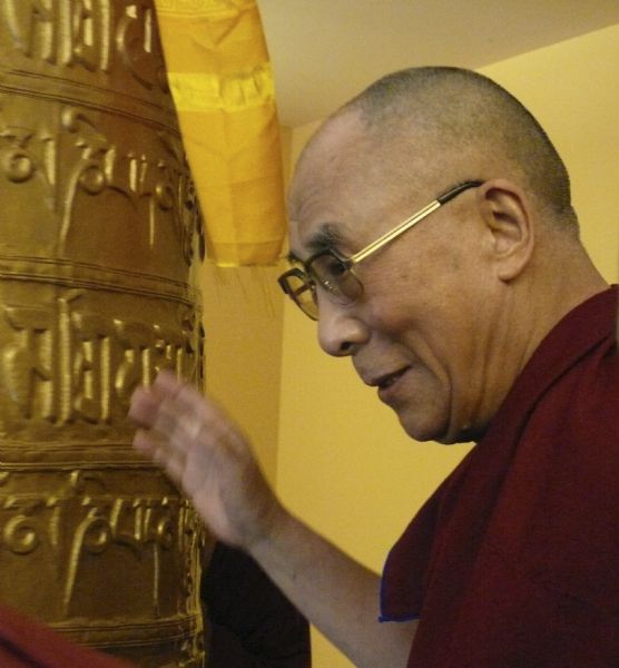 His Holiness, the Dalai Lama with the prayer wheel at the Deer Park Buddhist Center.