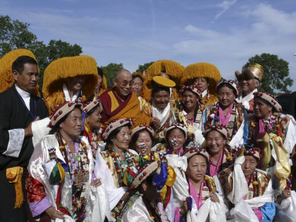 His Holiness, the Dalai Lama and Tibetan dancers at Dane County Coliseum.