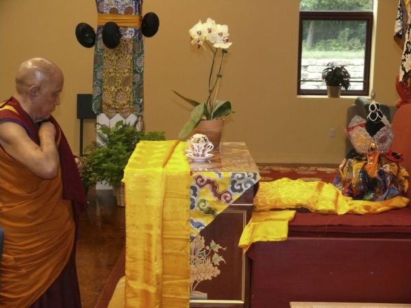 Jangste Choje Rinpoche paying respects to Geshe Sopa's ashes after the cremation. Deer Park Buddhist Center.