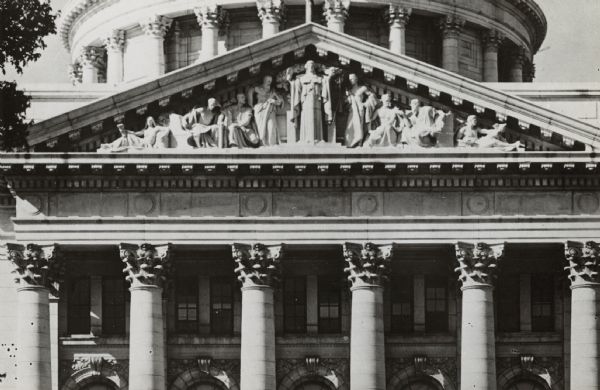 The Wisconsin State Capitol south pediment, with figures representing wisdom, equity, rectitude, executive power, meditation, prudence, calmness and caution of diplomacy, the earnestness of eloquence, and the clear vision of progress.