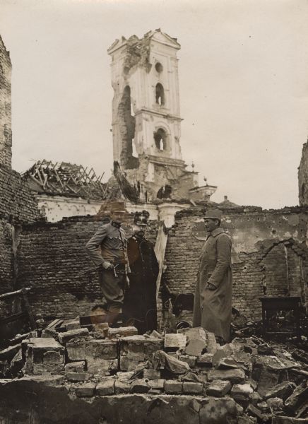 Soldiers posing amid the rubble of a destroyed church in the City of Sabac, Serbia.