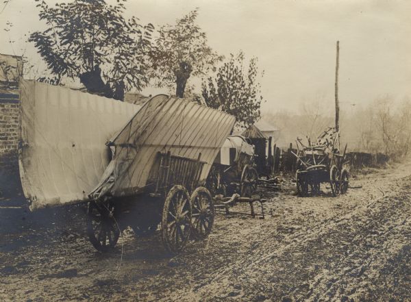 Wagons transporting an Austrian aircraft through the mud during World War I. 