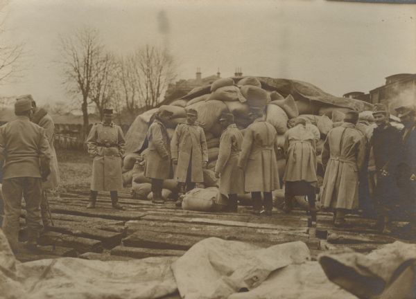 Austrian soldiers are preparing sandbags for the building bunkers and trenches in Serbia.