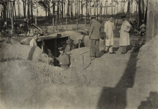 Convalescing German soldiers, in Berlin, building model trenches both for training and exhibition.