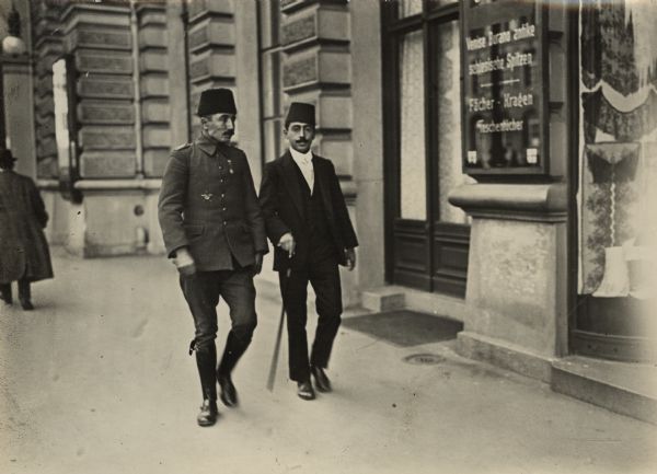 Two Turkish soldiers are walking the streets of Berlin. The men are convalescing in Berlin sometime after the Ottoman Empire entered the war on the side of Germany in October 1914.
