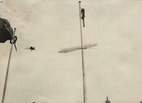 An airship flying over the celebration of the opening of the "Iron Hindenburg" monument in Berlin.