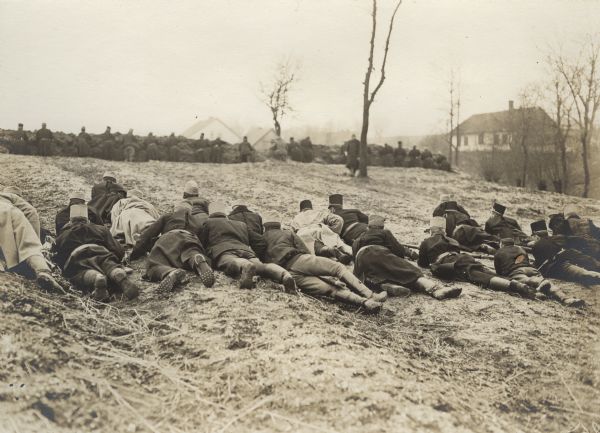 Among the latest battles of our allies in Galicia. The troops in the foreground are the reserve line waiting to go forward. In the background Austrian infantry has occupied Russian trenches.