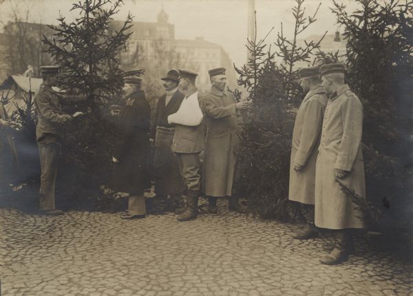 Wounded soldiers purchasing a Christmas tree.