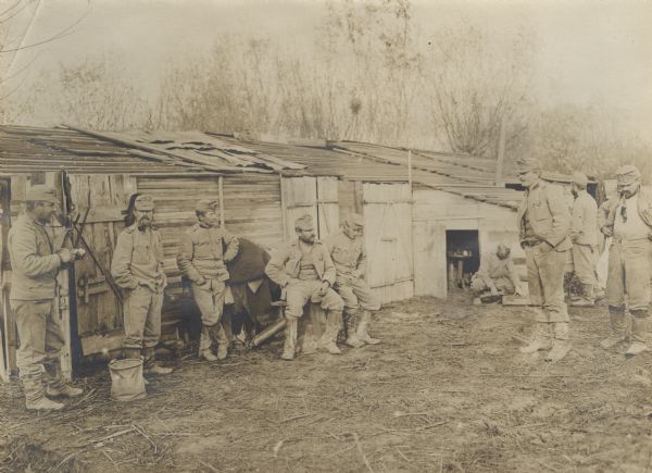 Soldiers gathered around in the winter camp in Serbia.