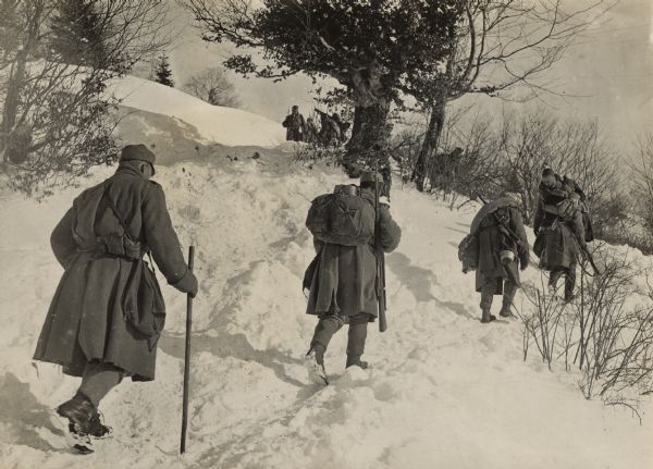 Austrian soldiers on patrol in the snow-covered forests of the Carpathians. 