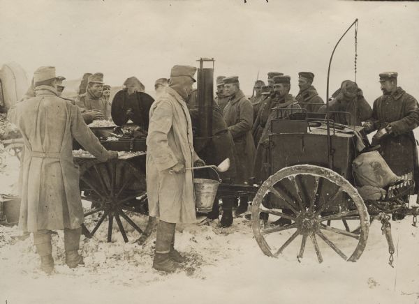 German and Austrian soldiers at a field kitchen. 