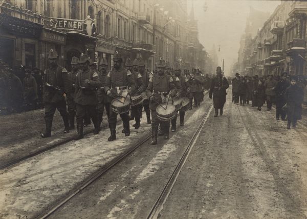 German Landsturm (reservist) band playing as they march down a street in Lodz in Poland.