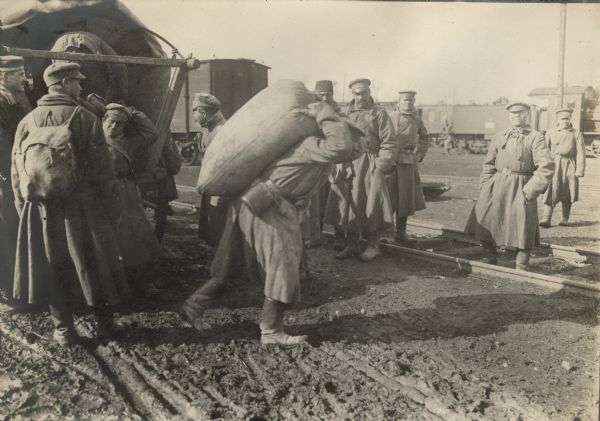 Arrival of a large shipment of flour being unloaded by Russian prisoners who defected to the Germans.