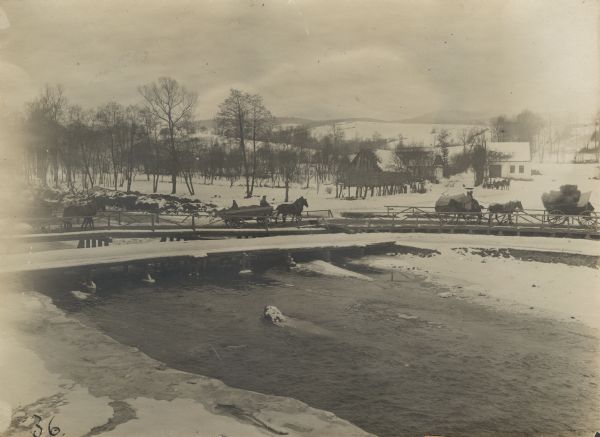 Temporary bridge and plank road over the Tolpa River in Poland. In order to improve the bad roads, plank bridges  have been constructed and are proving very useful.