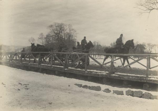 Temporary bridge and plank road over the Tolpa River in Poland. In order to improve the bad roads, plank bridges have been constructed and are proving very useful.