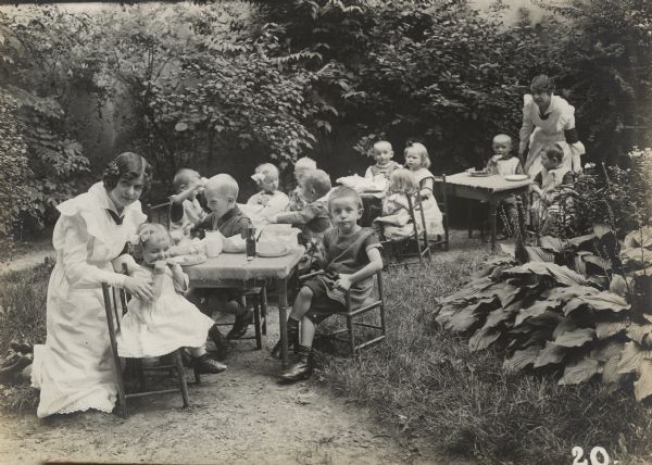 Daycare for the children of soldiers. Children are cared for and given food daily, without charge, by volunteer aids.