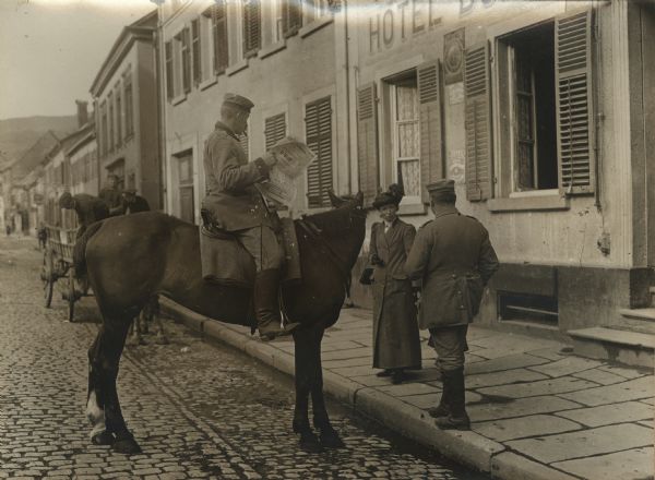 Our Bavarians in the Vosges. A German soldier on horseback reading the newspaper with "Good News."