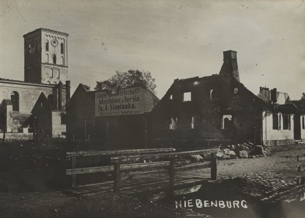 Scene of destroyed and burned out buildings after the Russian occupation. Handwritten at bottom right: "Niedenburg."