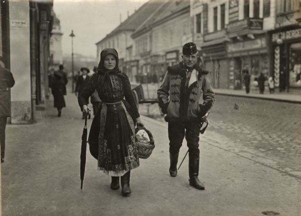 Hungarian hussar, and his wife, heading for the train station.