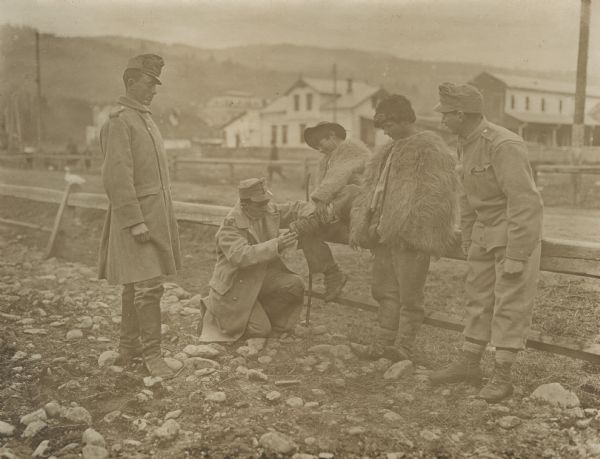 Austrian soldiers and civilian youth.