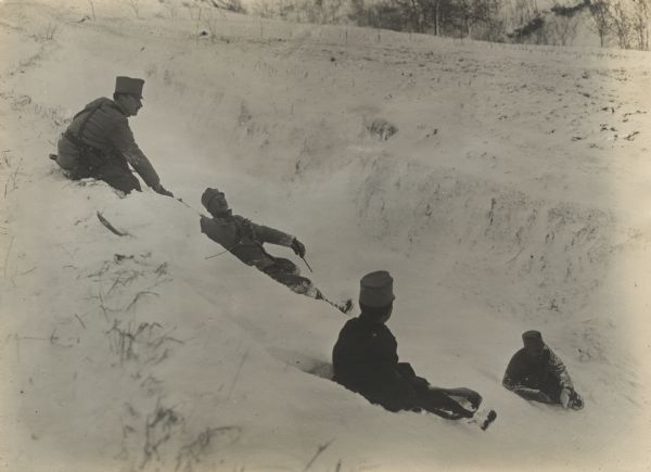 Austrian soldiers sliding in the snow.