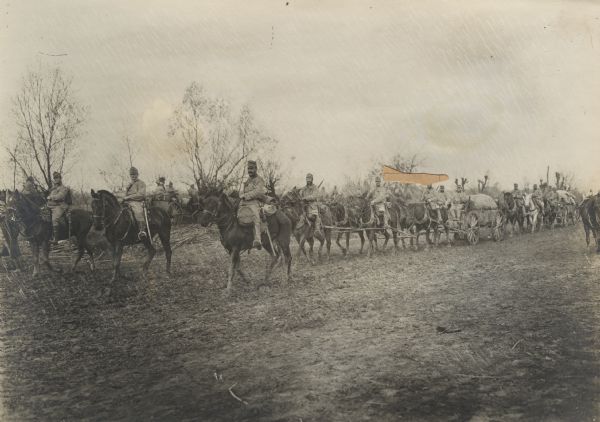 Soldiers marching with supplies to the front.