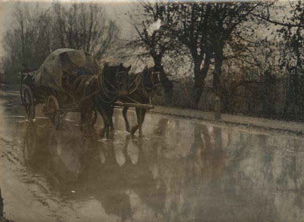 Wagon moving through Serbia during a storm.