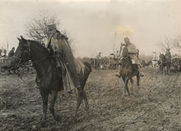 Patrol on the front marches through the muddy conditions during a storm.