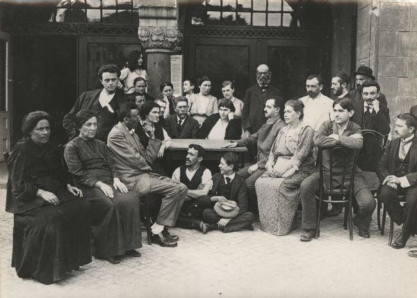 A group of refugees posing for a group portrait in the courtyard of the Berlin zoo.