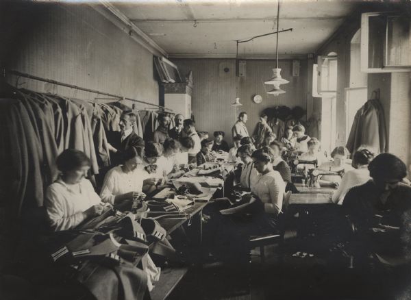 Home workers working daily to prepare uniforms for the military.