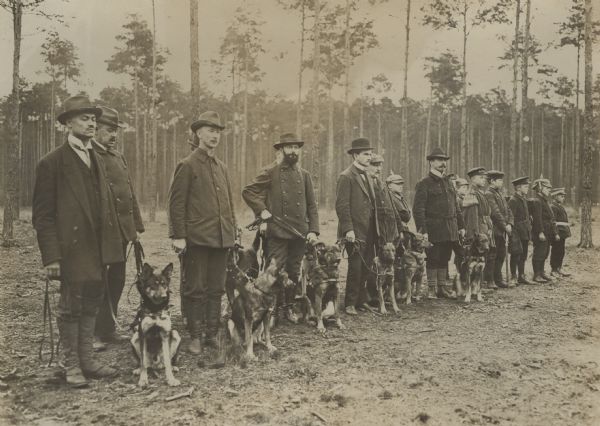 German first aid dogs and their trainers on parade.