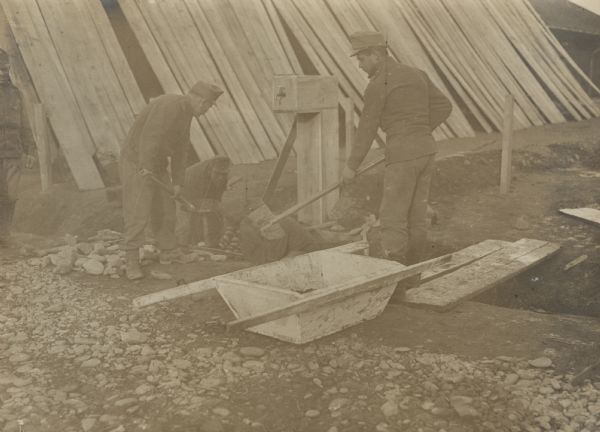 Taking precautions against cholera and dysentery on Galicia. Barracks buildings are being surrounded with trenches filled with lime.