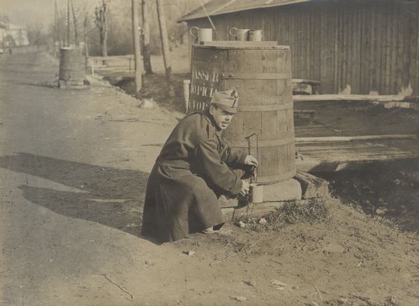 Taking precautions against cholera and dysentery on Galicia. Distilled water for soldiers. The guard is ensuring that the water is not contaminated.