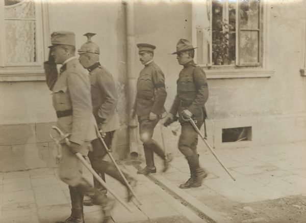 U.S. Army officers — Captain McIntire and Major Ford. Military attachés from neutral countries, such as the United States, would have received permission to visit battle zones on escorted trips.