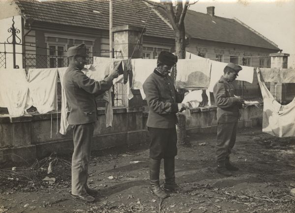 Soldiers washing their uniforms.