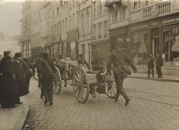 Our naval infantry in Antwerp on their way out of the city. German forces occupied Antwerp on October 10th, 1914 after a two week siege.