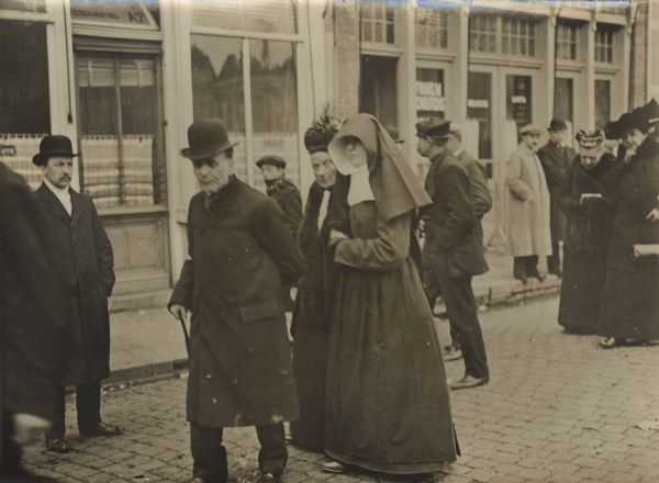 Belgian nuns returning home from camps in the Netherlands. They are welcomed by their families and friends.