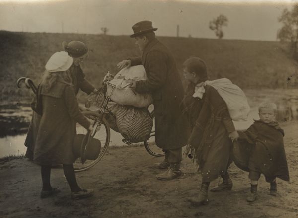 Refugees taking their belongings with them as they move from place to place.