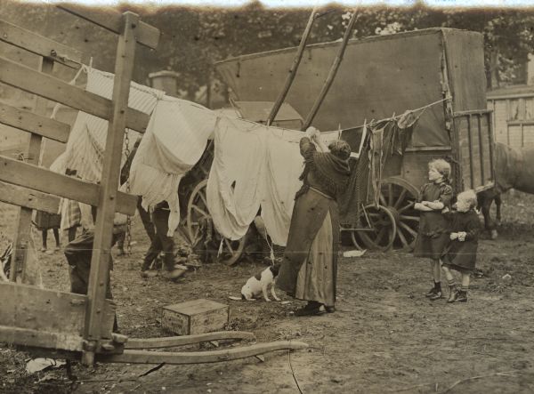 Belgian refugees hanging up their clothes after the daily washing.